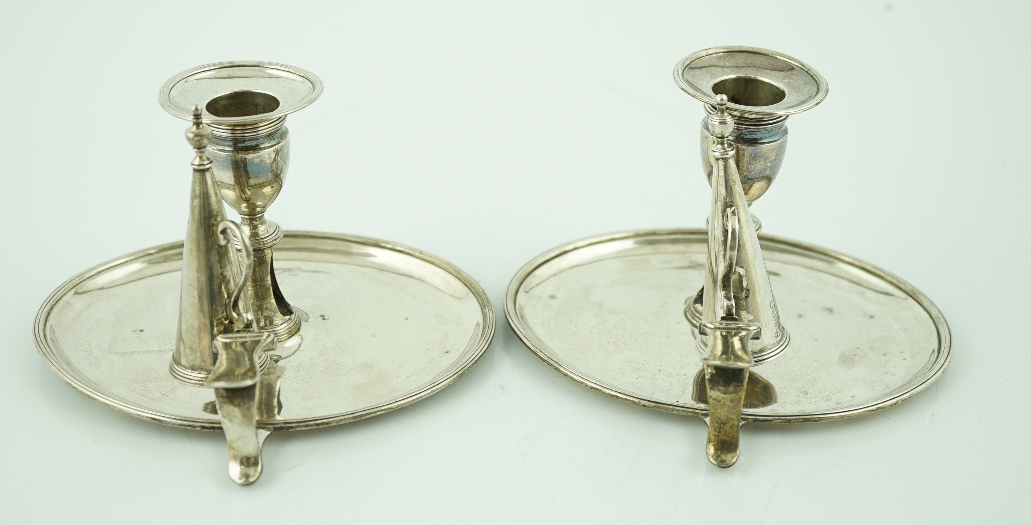 A pair of George III silver chambersticks, by Walter Brind